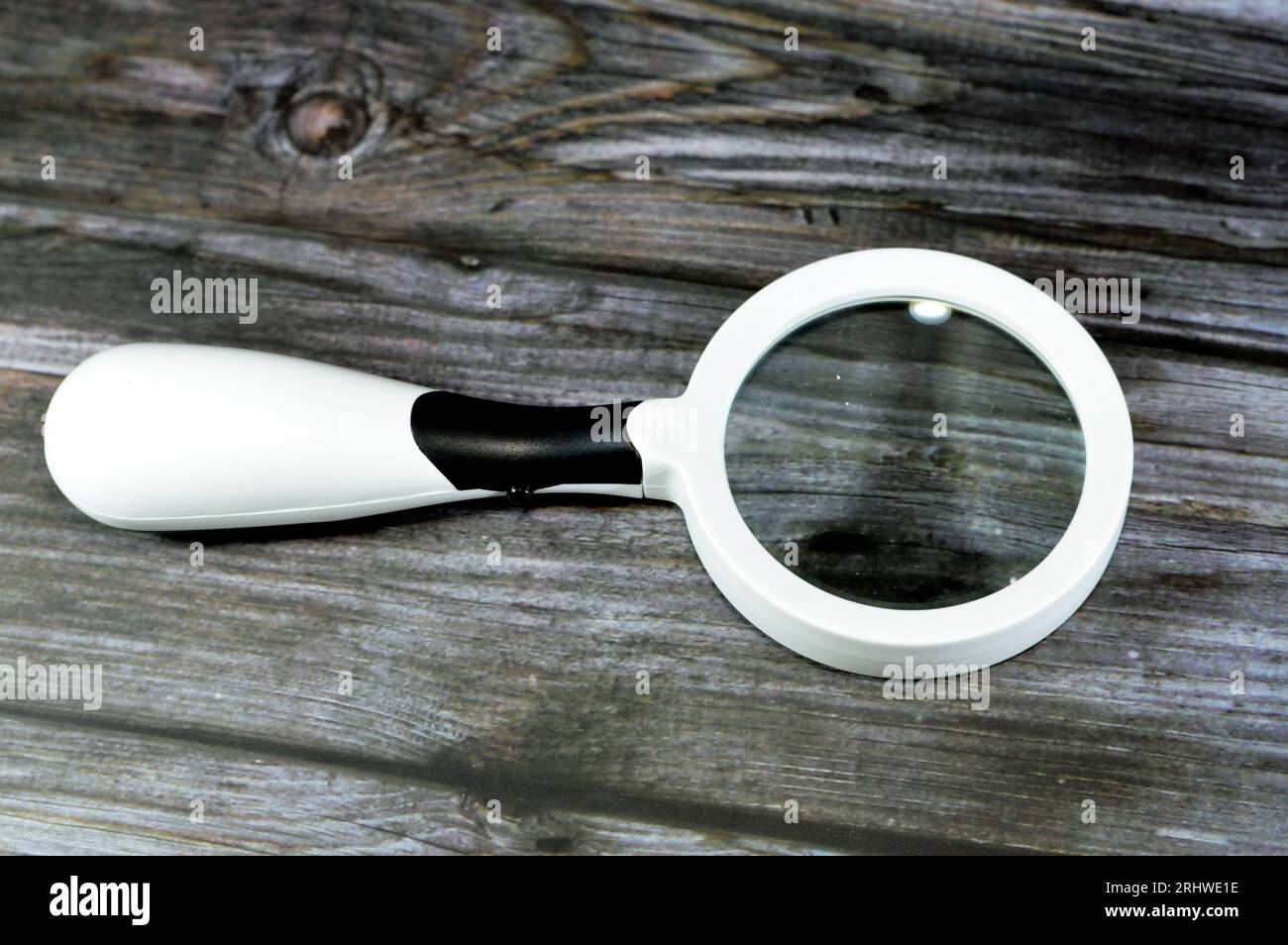 A magnifying glass, a convex lens that is used to produce a magnified