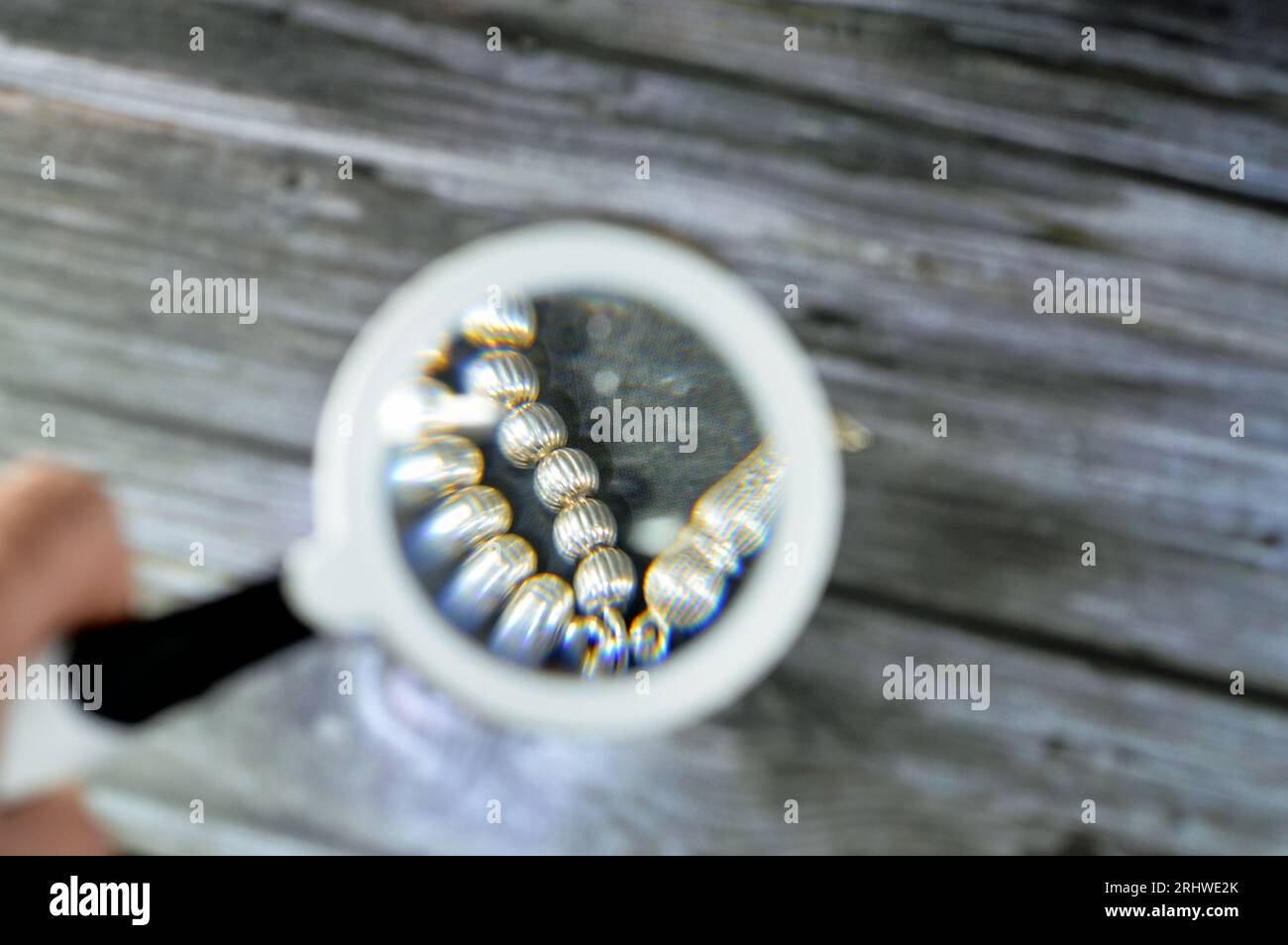A magnifying glass, a convex lens that is used to produce a magnified