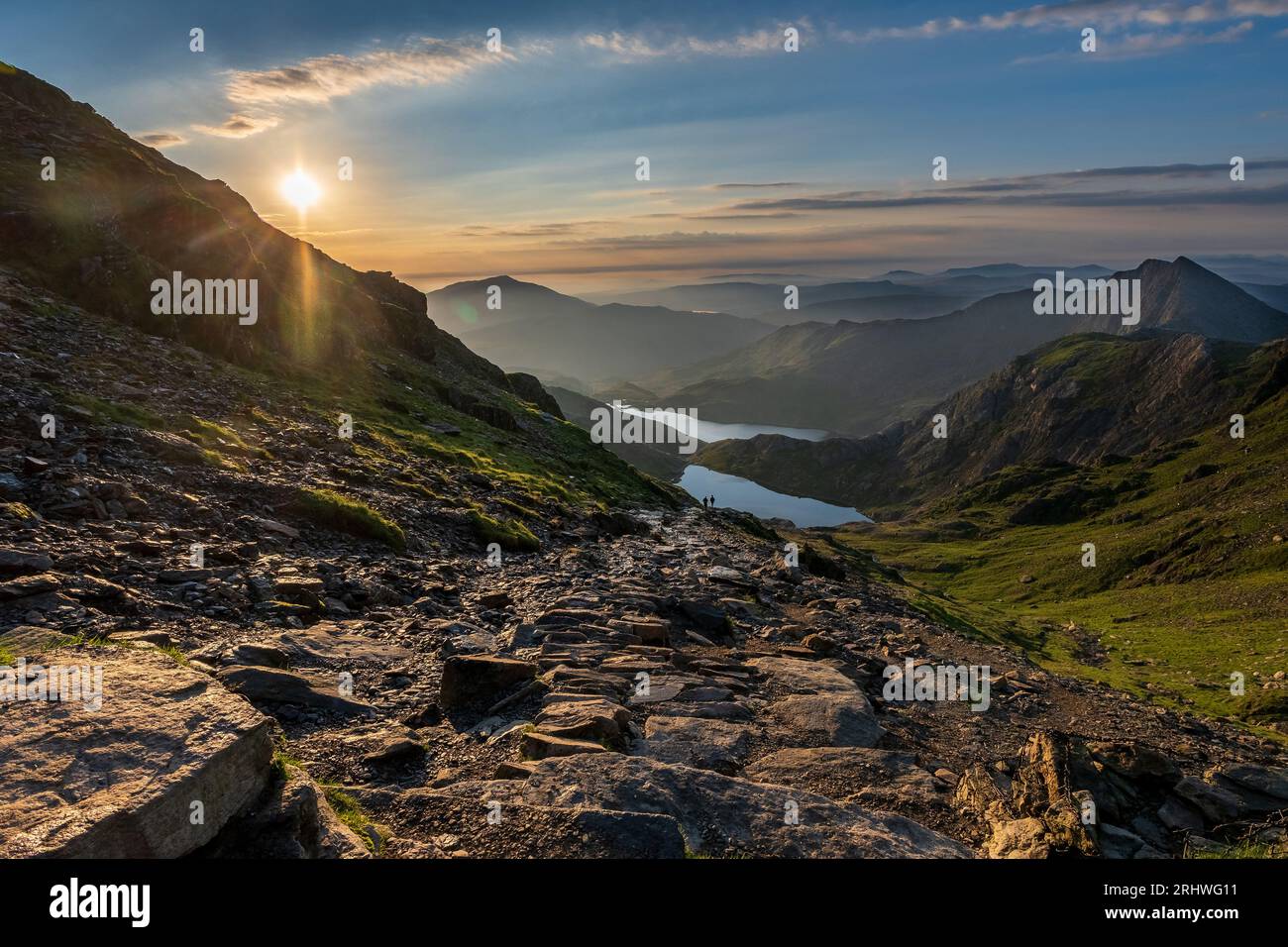 Snowdonia. The sunrise view fromthe top of Mount Snowdon, Yr Wyddfa, looking east towards Glaslyn lake ( nearest camera ) and Llyn Llydaw behind. Snow Stock Photo