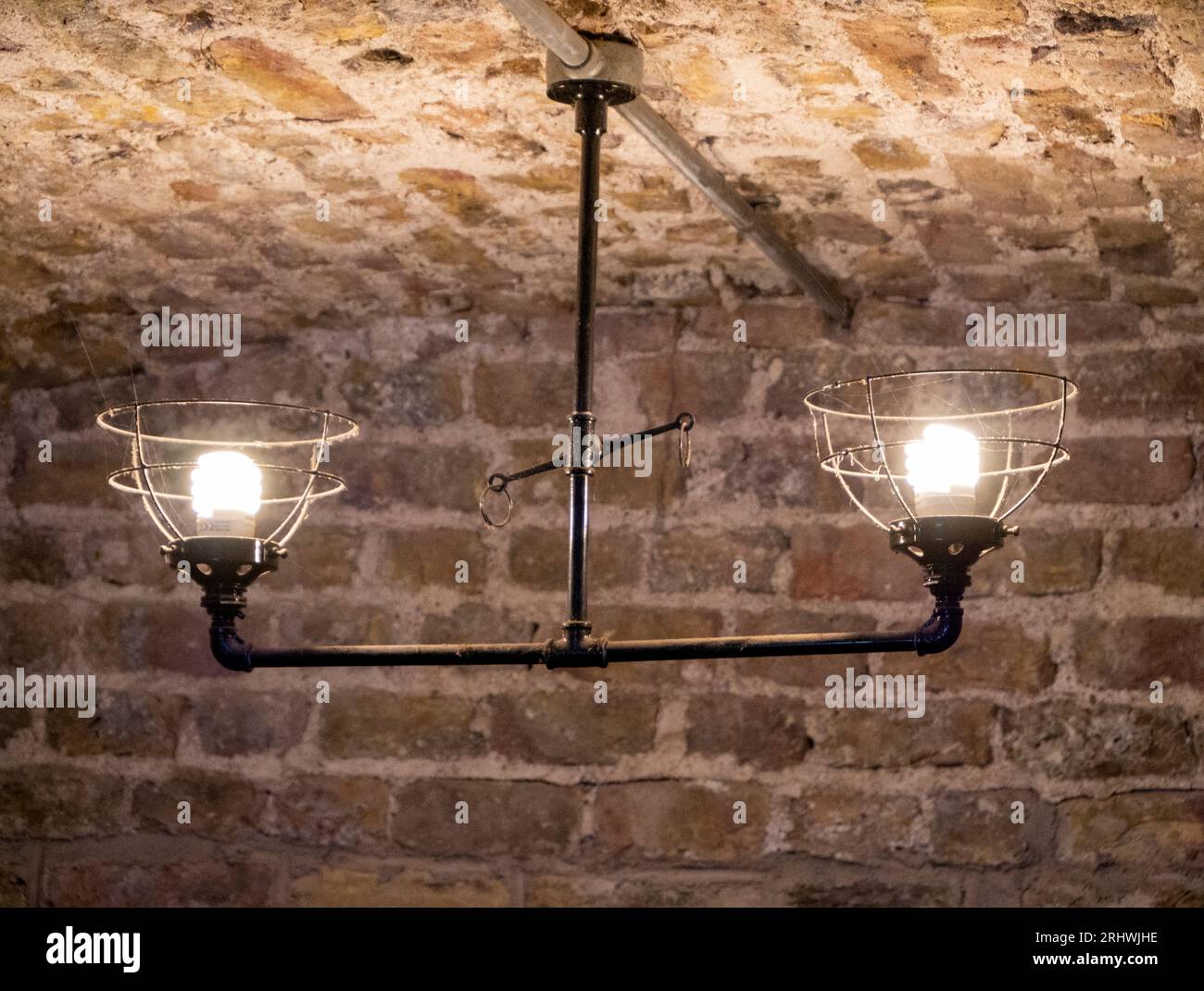 Old ancient lamps on the wall in a dark room background, gloomy light ...