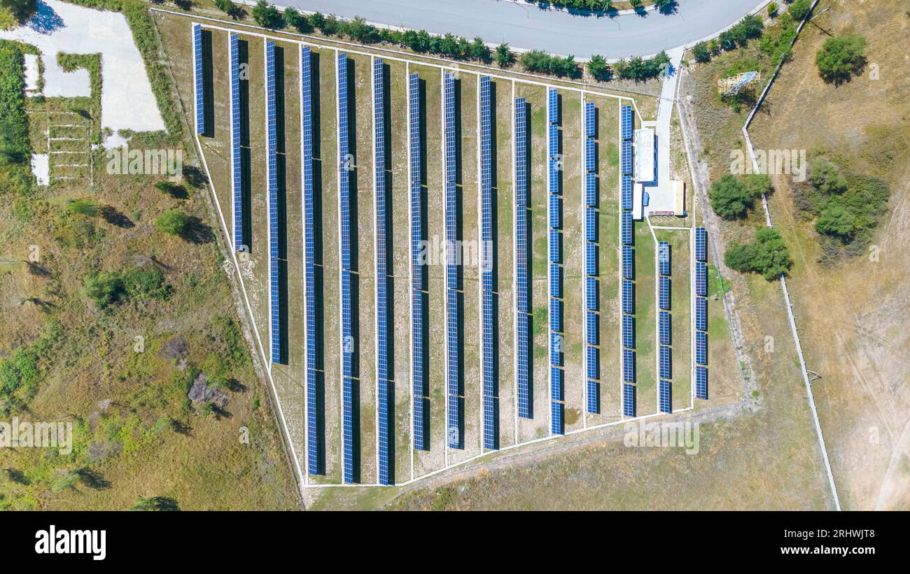 Large Solar Power Large solar power plant with fenced area. Green energy Stock Photo - Alamy
