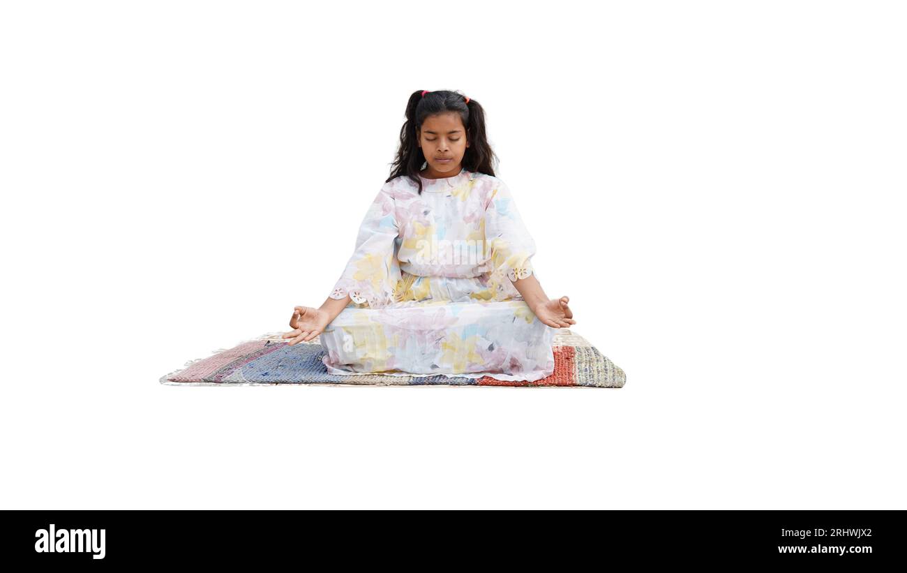 Calm millennial Indian girl laying on floor in living room practice yoga with mudra. Stock Photo