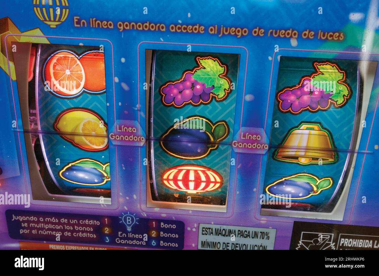 Symbols on reels of slot machine, or fruit machine marked in Spanish language. Stock Photo