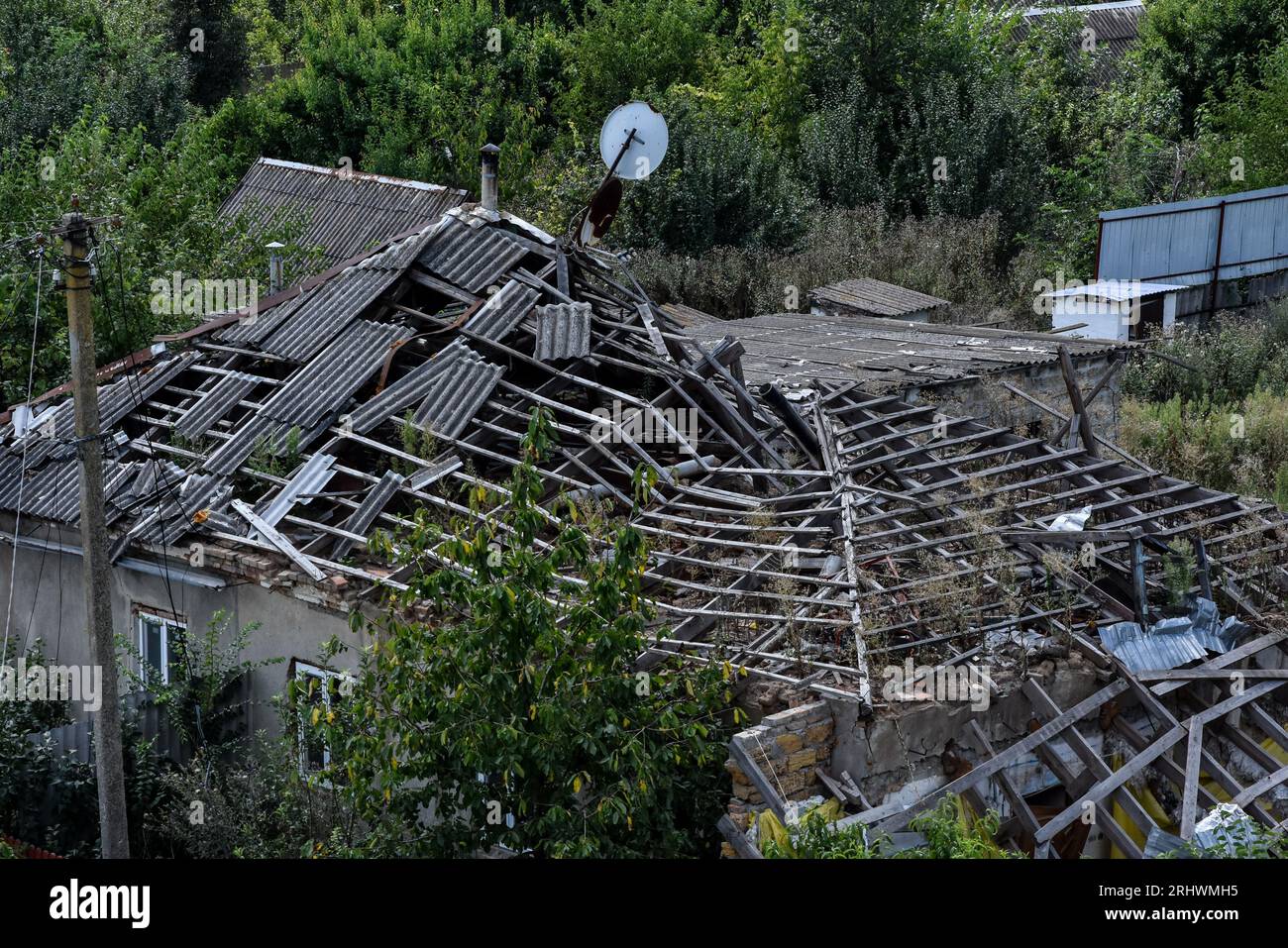 A view of a heavily damaged private house by the Russian shelling in