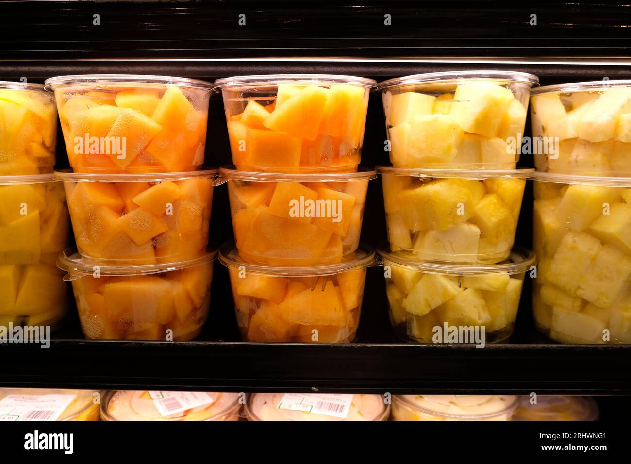 Chopped Fruits Plastic Packaged at Supermarket Stock Photo