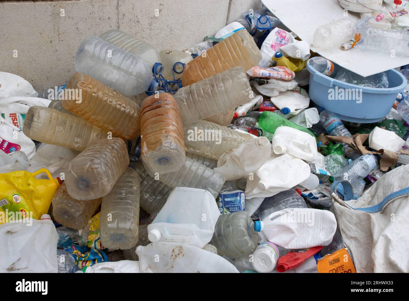 16 october 2022 Almada, Portugal: dirty five-liter plastic bottles in a recycling dump. Mid shot Stock Photo