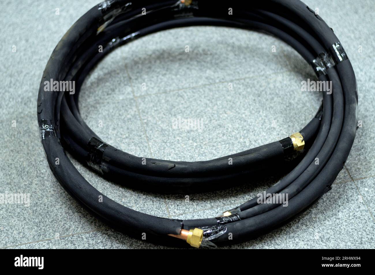 Air conditioning copper pipes tubes covered with black rubber, copper