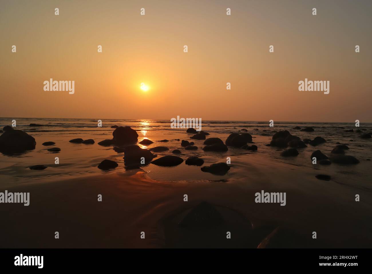 Sunset view at the rocky sea beach of Cox's Bazar Stock Photo - Alamy