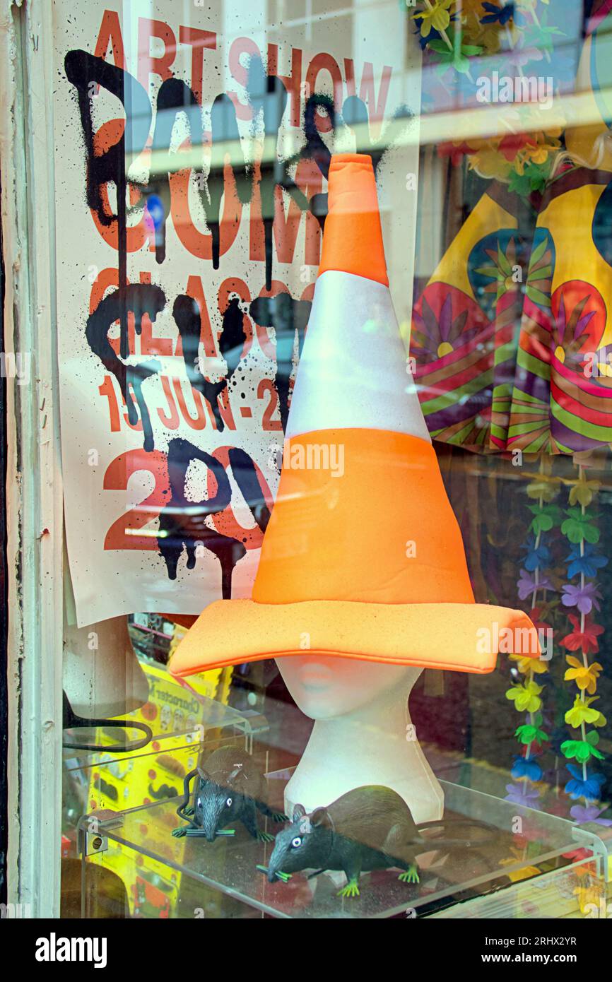 Glasgow, Scotland, UK. 19th  August, 2023. Banksy fever continues as a local joke shop, tam Shepard's, posts two very good tributes to the exhibition in his window as he was one of the chosen places for the exhibition poster to be shown. The iconic rat and poster combined.  Credit Gerard Ferry/Alamy Live News Stock Photo
