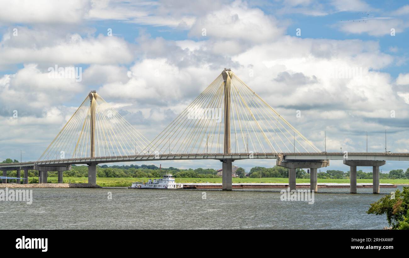 towboat with barges os passing under the Clark Bridge, a cablestayed