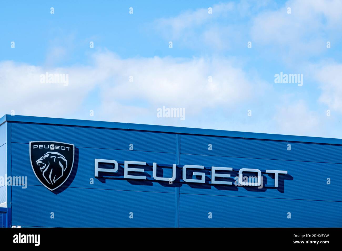 Peugeot sign and logo on outside wall Stock Photo
