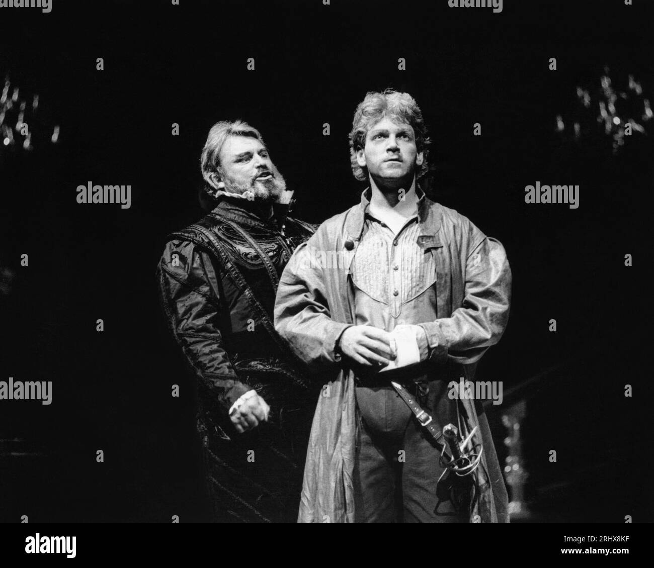 l-r: Brian Blessed (Claudius), Kenneth Branagh (Laertes) in HAMLET by Shakespeare at the Royal Shakespeare Company (RSC), Royal Shakespeare Theatre, Stratford-upon-Avon, England  05/09/1984  design: Maria Bjornson  lighting: Chris Ellis  fights: Malcolm Ranson  director: Ron Daniels Stock Photo