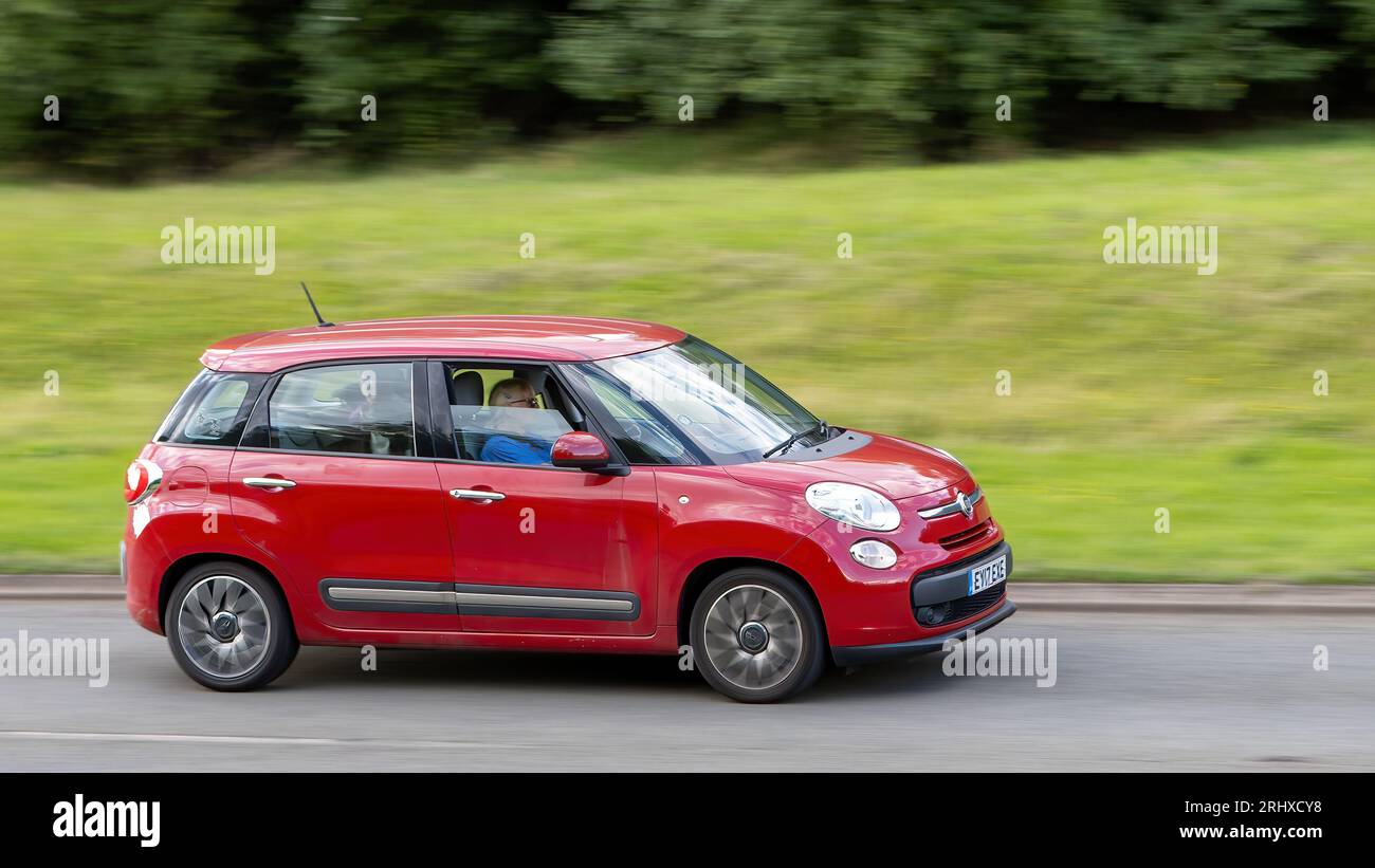 Milton Keynes, UK - Aug 16th 2023:  2017 red Fiat 500L car travelling on an English road Stock Photo