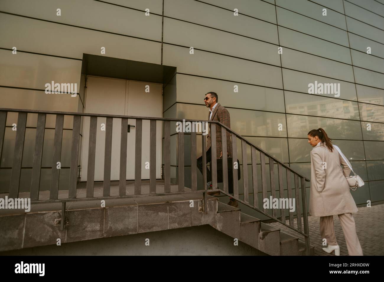 Two people going up the stairs hi-res stock photography and images - Alamy