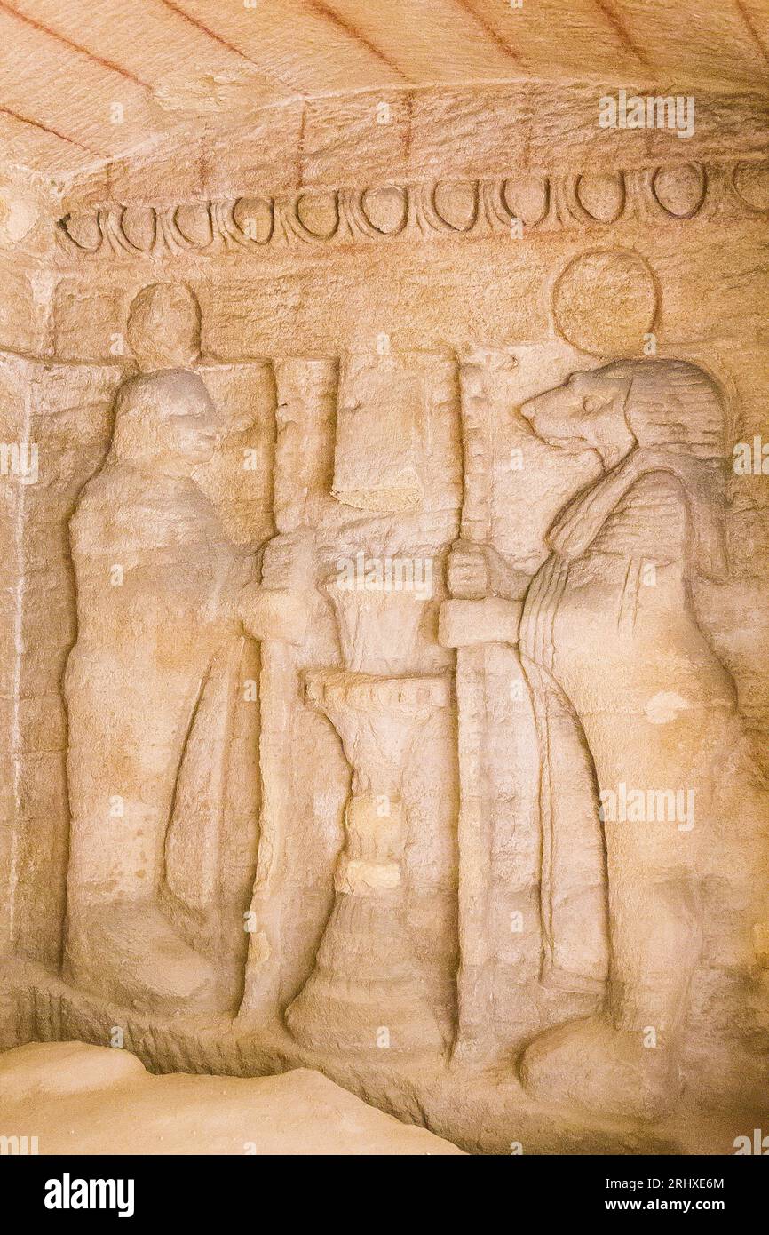 Kom el Shogafa necropolis, main tomb, main room, right niche, right scene : 2 solar mummies, maybe sons of Horus. Stock Photo