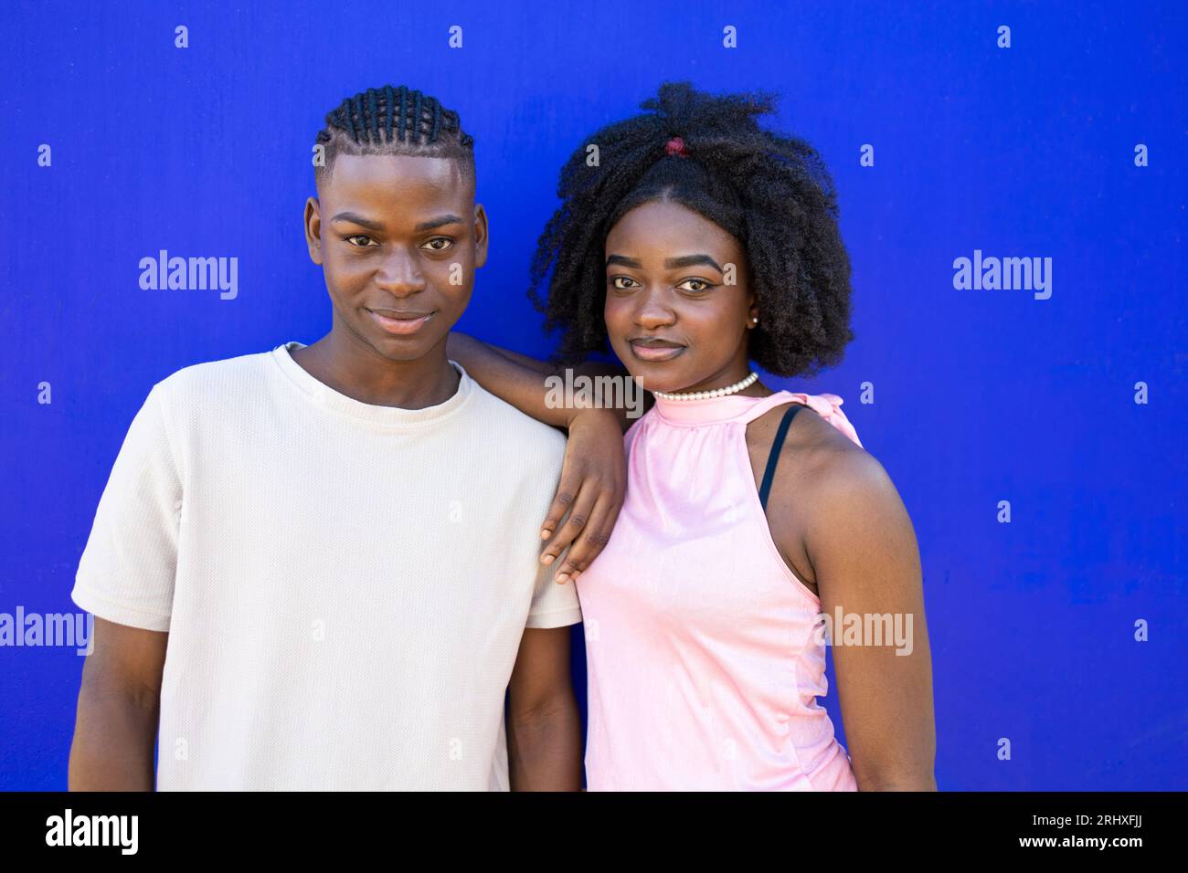 Positive young African American couple in casual clothes with Afro ...
