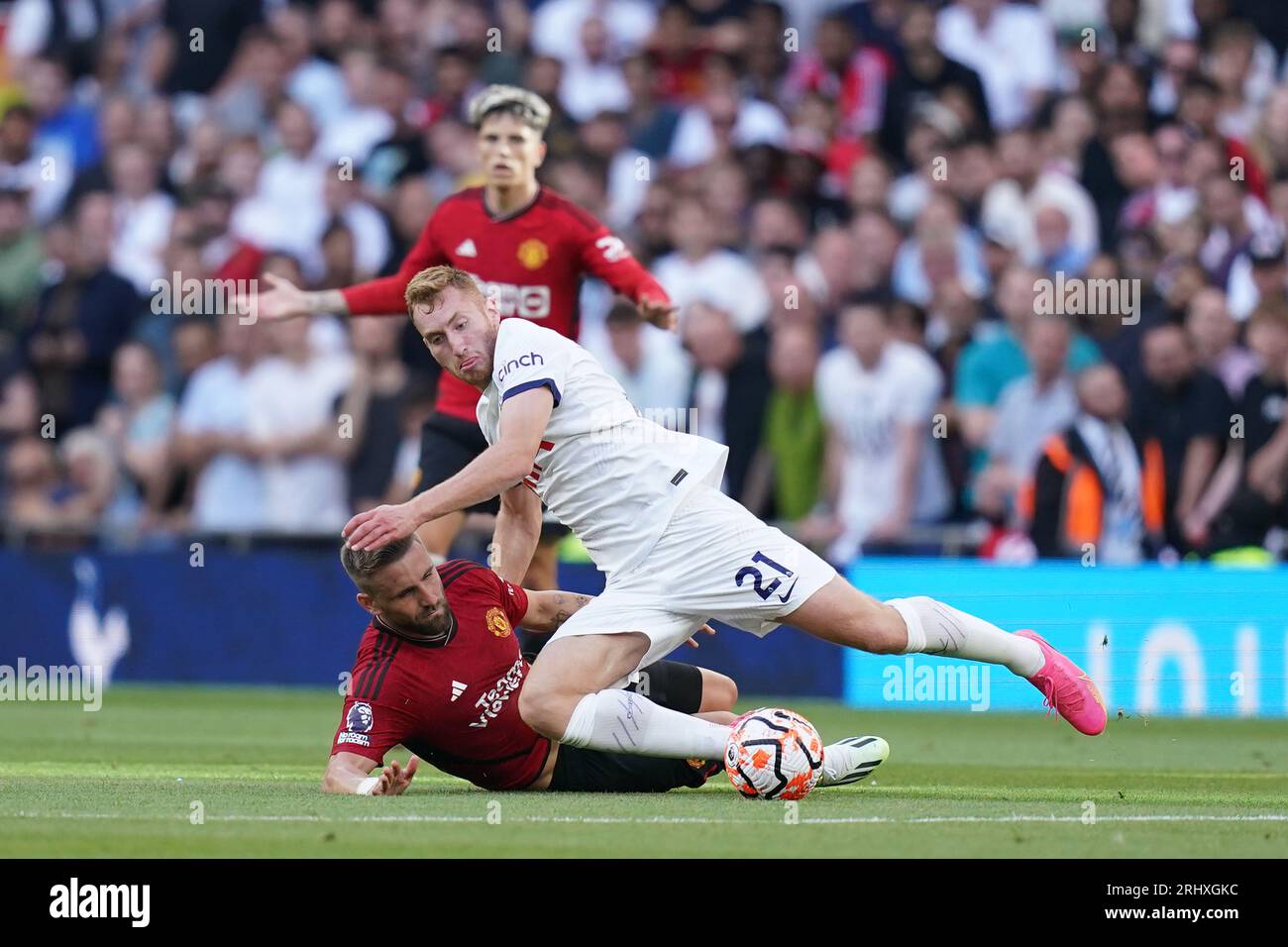 Manchester United's Luke Shaw (left) and Tottenham Hotspur's Dejan Kulusevski battle for the ball during the Premier League match at the Tottenham Hotspur Stadium, London. Picture date: Saturday August 19, 2023. Stock Photo