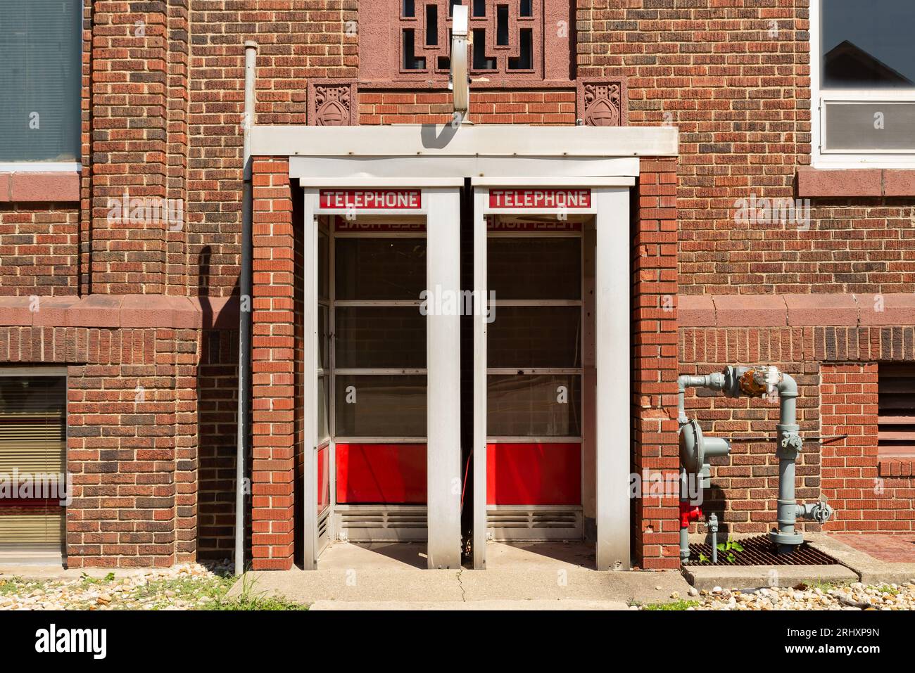Old telephone booths in brick building.  Dixon, Illinois, USA. Stock Photo