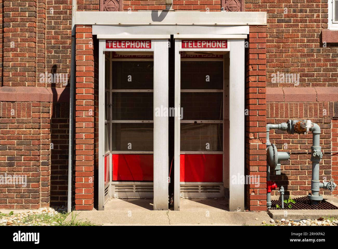 Old telephone booths in brick building.  Dixon, Illinois, USA. Stock Photo