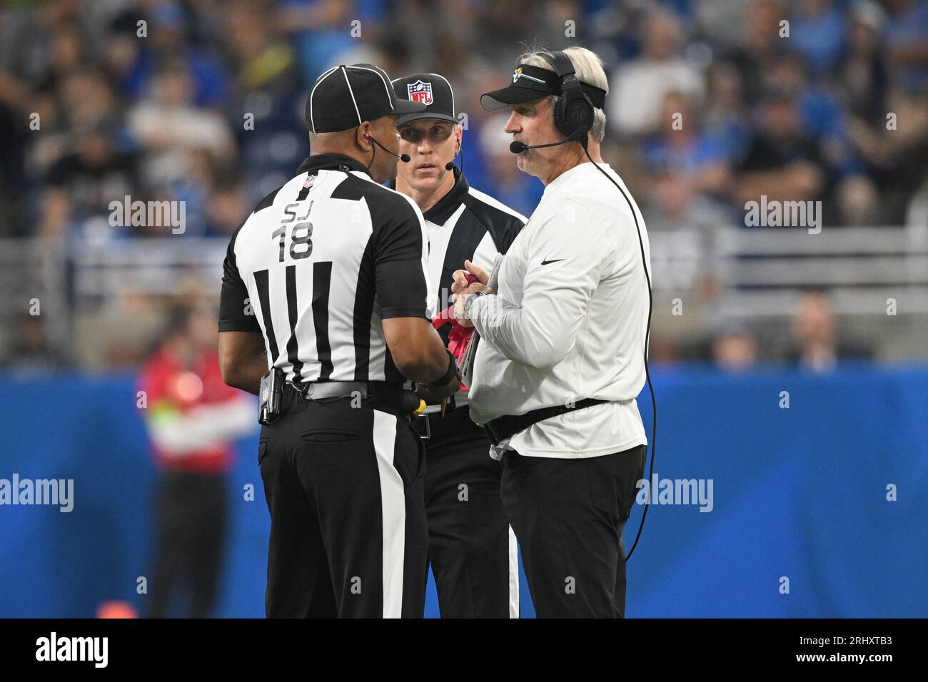 DETROIT, MI - AUGUST 19: Jacksonville Jaguars head coach Doug Pederson  talks to side judge Clay Reynard (18) during a replay review in the  exhibition game between Jacksonville Jaguars and Detroit Lions