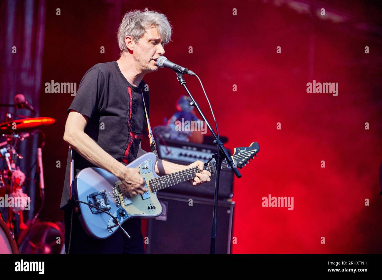 Hamburg, Germany. 19th Aug, 2023. The musician Dirk von Lowtzow from the rock band Tocotronic from Hamburg stands on the open-air stage in the city park. The concert took place as part of the "Nie wieder Krieg Tour 2023". Credit: Georg Wendt/dpa/Alamy Live News Stock Photo