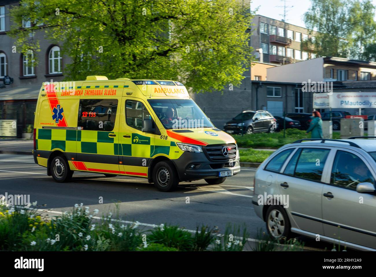 OSTRAVA, CZECH REPUBLIC - MAY 4, 2023: Mercedes-Benz Sprinter ambulance car with slight motion blur effect avoiding other cars on the road Stock Photo