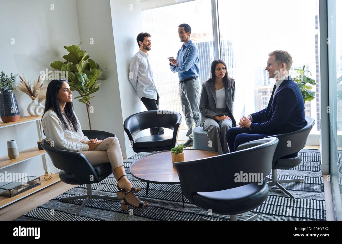 International team business people talking in office lobby. Authentic shot Stock Photo
