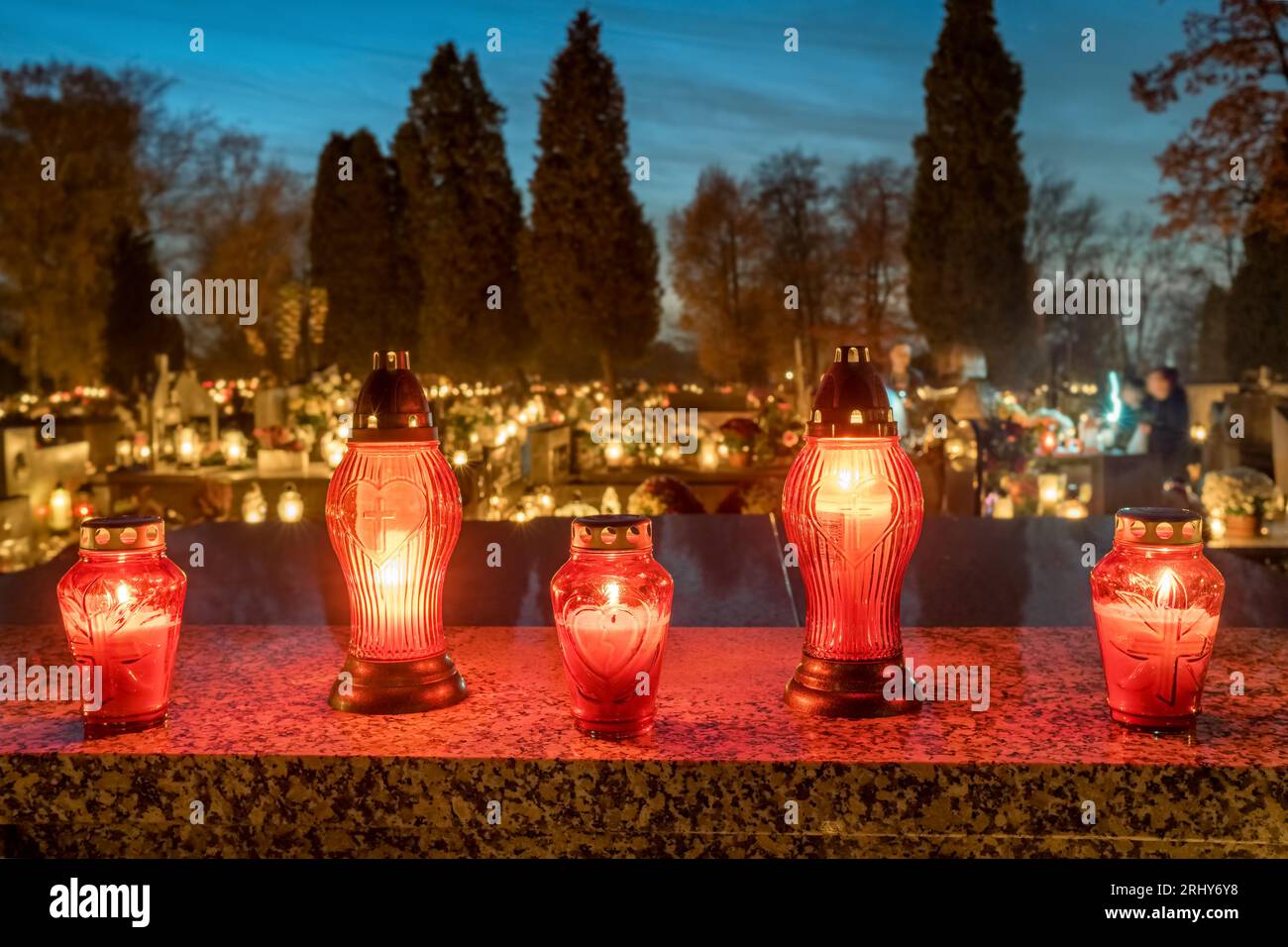 Candle lights at the cemetery at night in Poland during All Saints Day