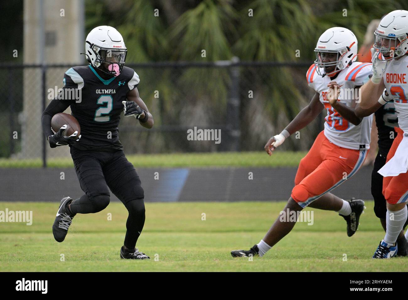 Olympia's Xavier Tucker (2) returns a kickoff in front of Boone's