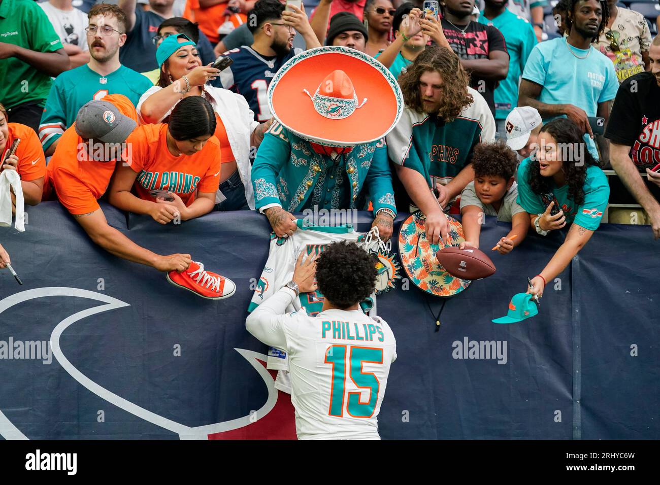 Miami Dolphins linebacker Jaelan Phillips (15) signs autographs following  an NFL preseason football game against the Houston Texans, Saturday, Aug.  19, 2023, in Houston. The Dolphins won 28-3. (AP Photo/Eric Gay Stock Photo  - Alamy, image size:1300x956