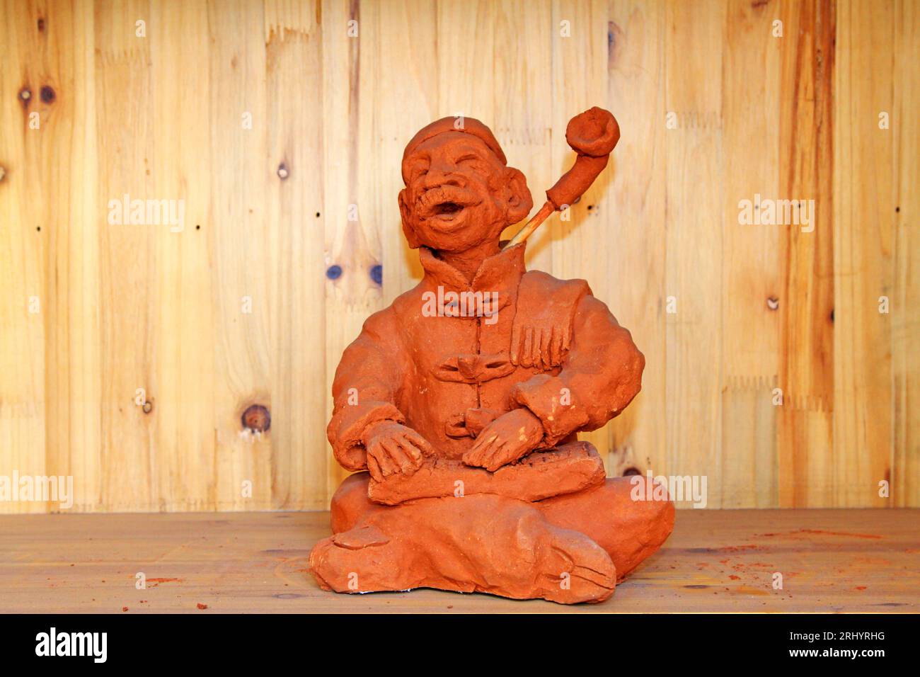Clay figurine works by hand in a shop Stock Photo Alamy