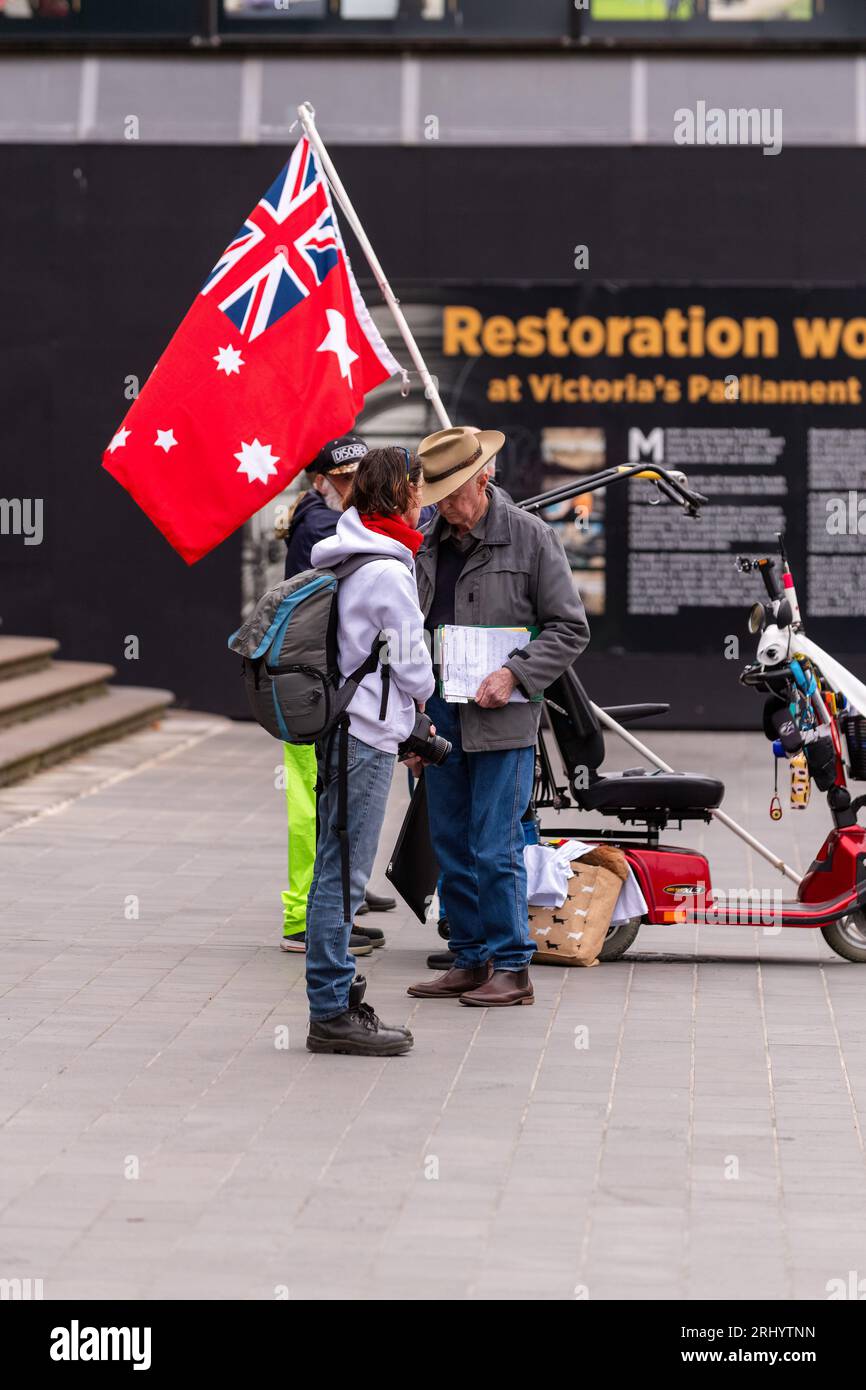 Melbourne, Australia, 19 August, 2023. Protesters with red ensign a flag used by right wing fringe groups during a small 'No Vote' rally on the steps of State Parliament in Melbourne, Australia 19 August 2023. Credit: Michael Currie/Speed Media/Alamy Live News Stock Photo