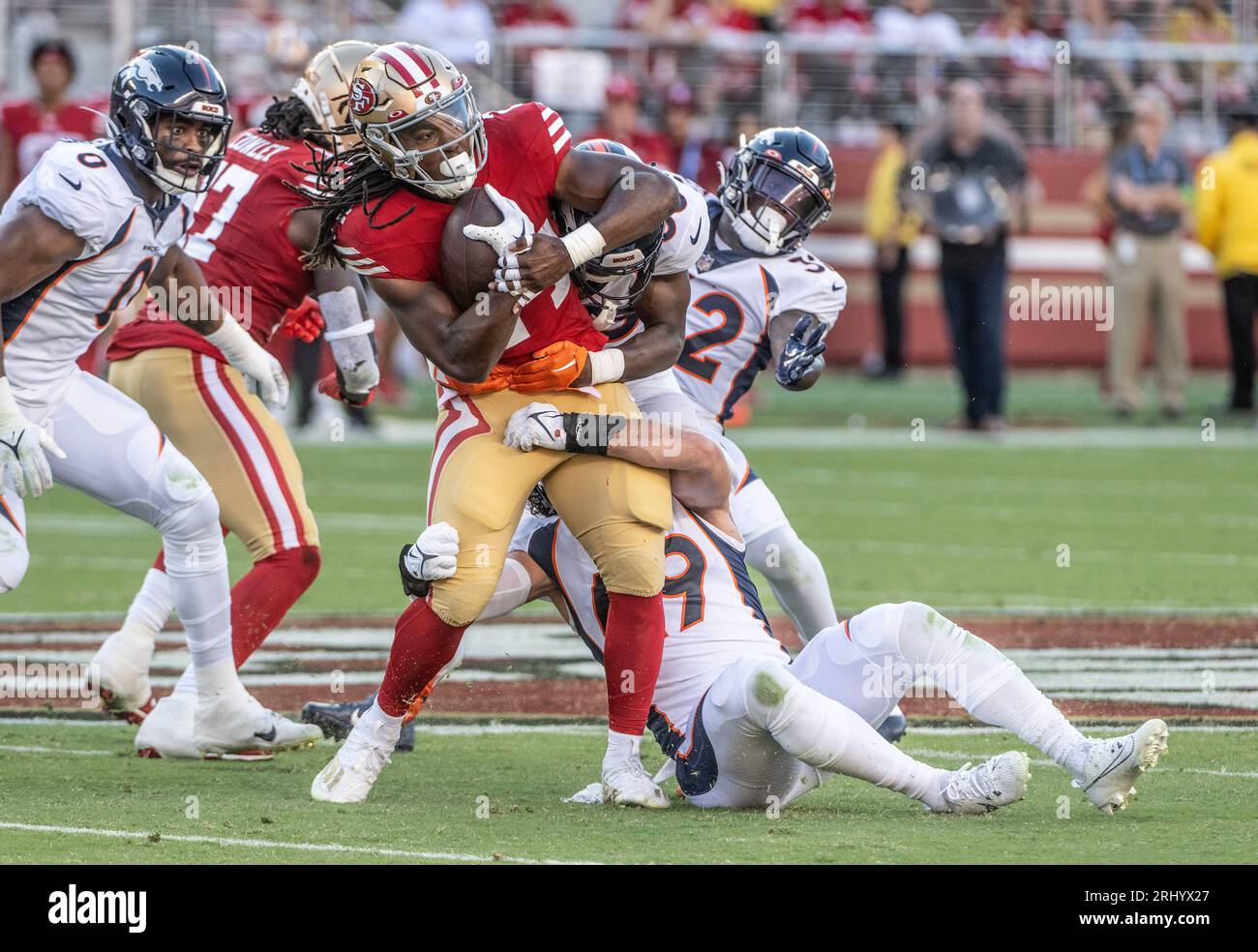 San Francisco 49ers running back Jordan Mason (24) is tackled in the
