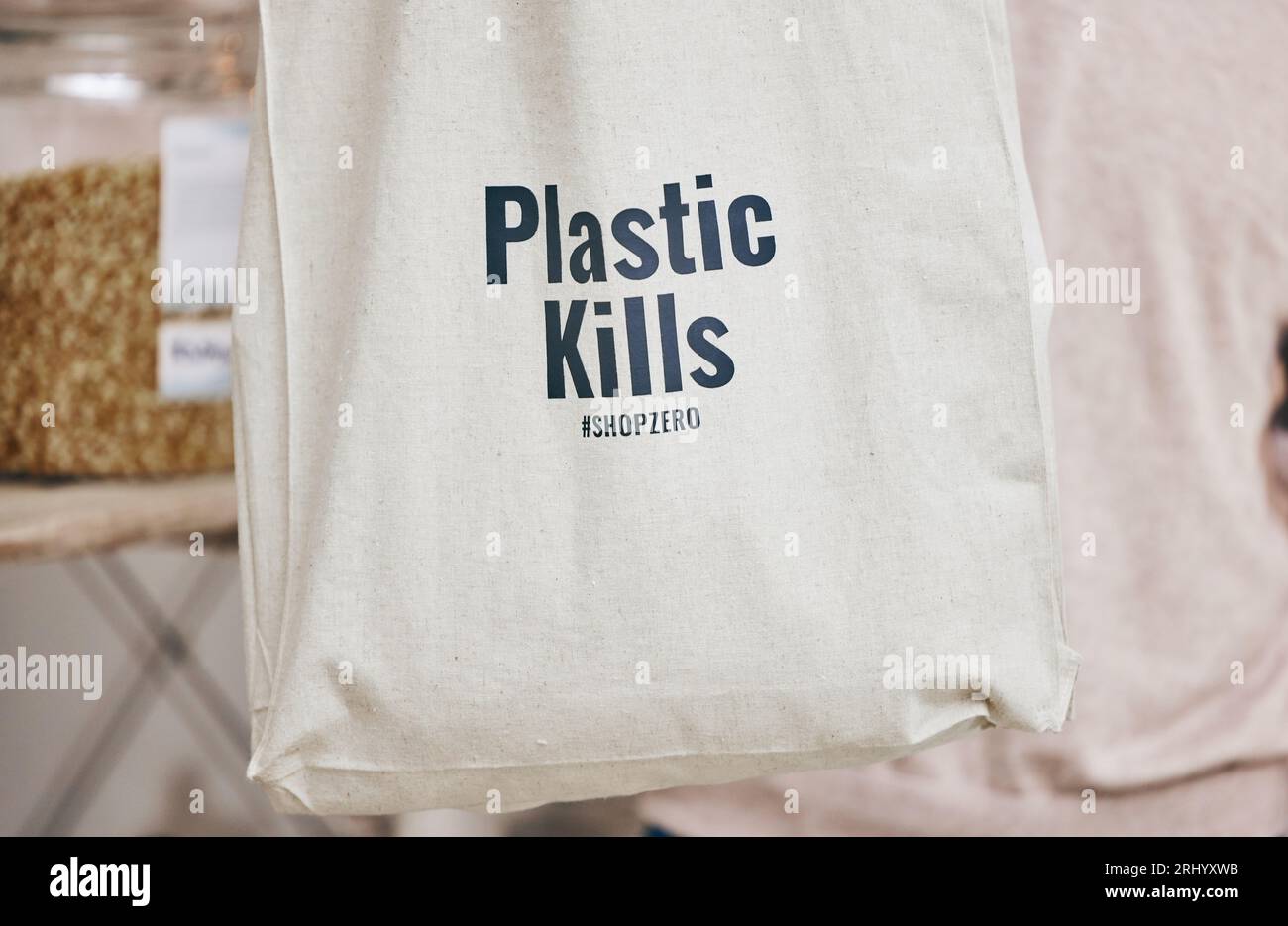 Eco friendly grocery store, recycling fabric shopping bag and commitment to climate change at sustainable small business. Zero waste, plastic kills Stock Photo