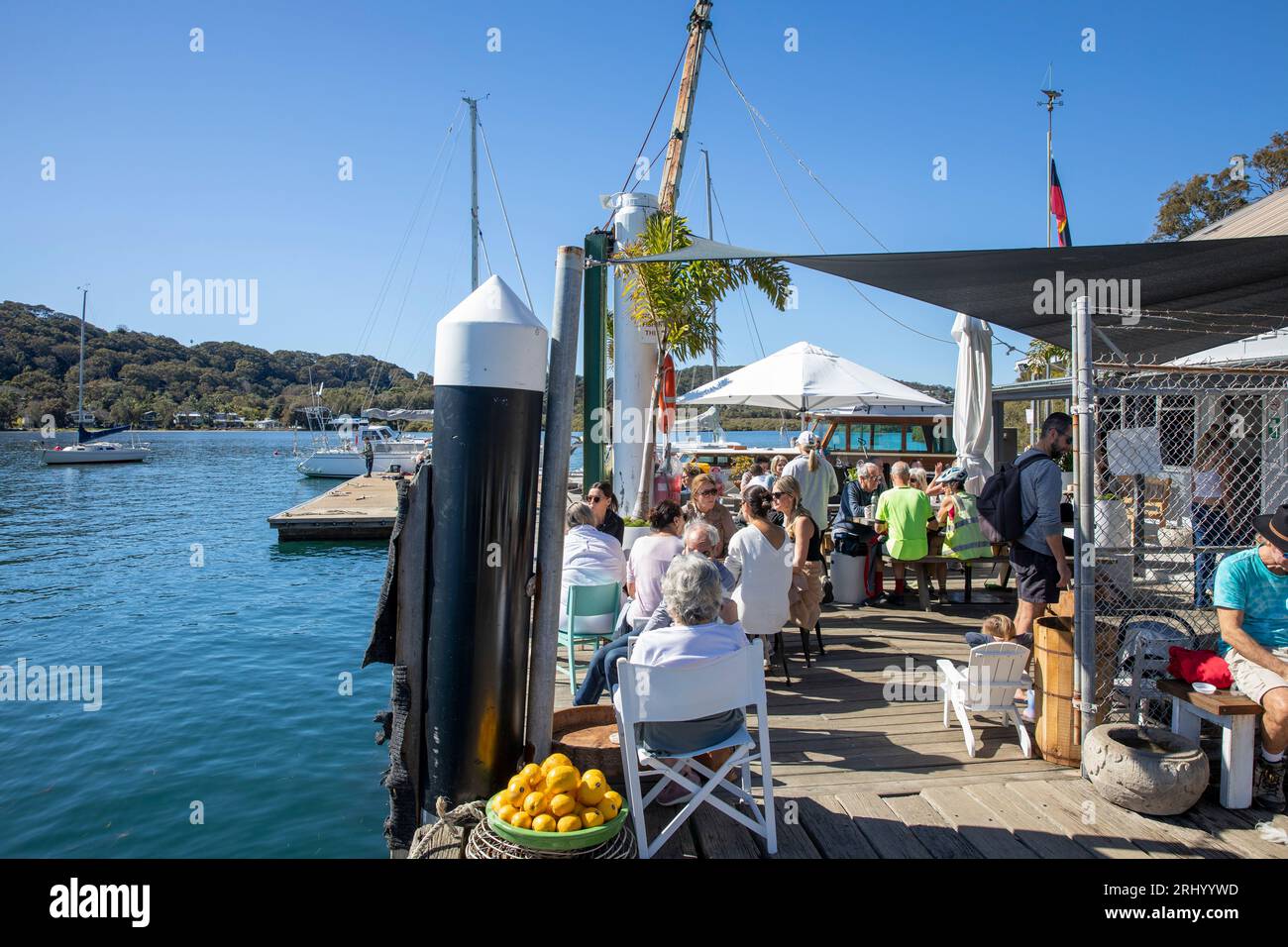 Sydney Australia people enjoy a waterfront cafe on sunny winters day at