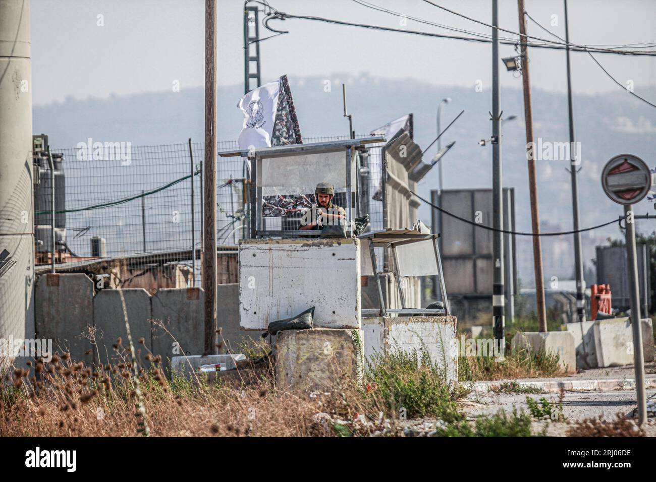 Nablus, Palestine. 19th Aug, 2023. An Israeli soldier stands guard at a ...
