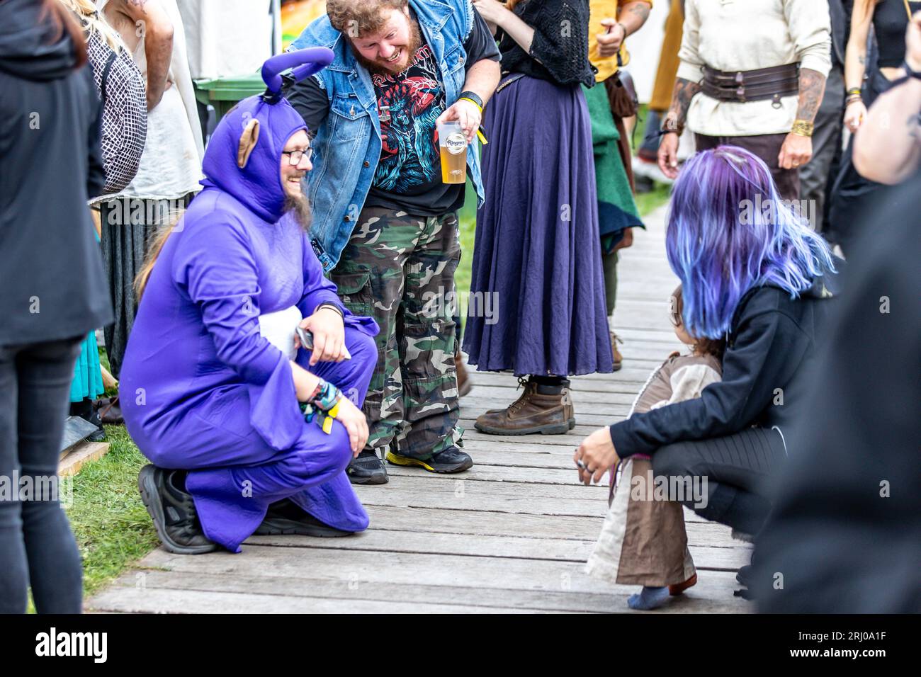 Horten, Norway, 19th August 2023. Tinky WInky chatting with a child at the Midgardsblot 2023 metal festival at the Midgard Viking Center in Horten, Norway  Credit: Frode Arnesen/Alamy Live News Stock Photo