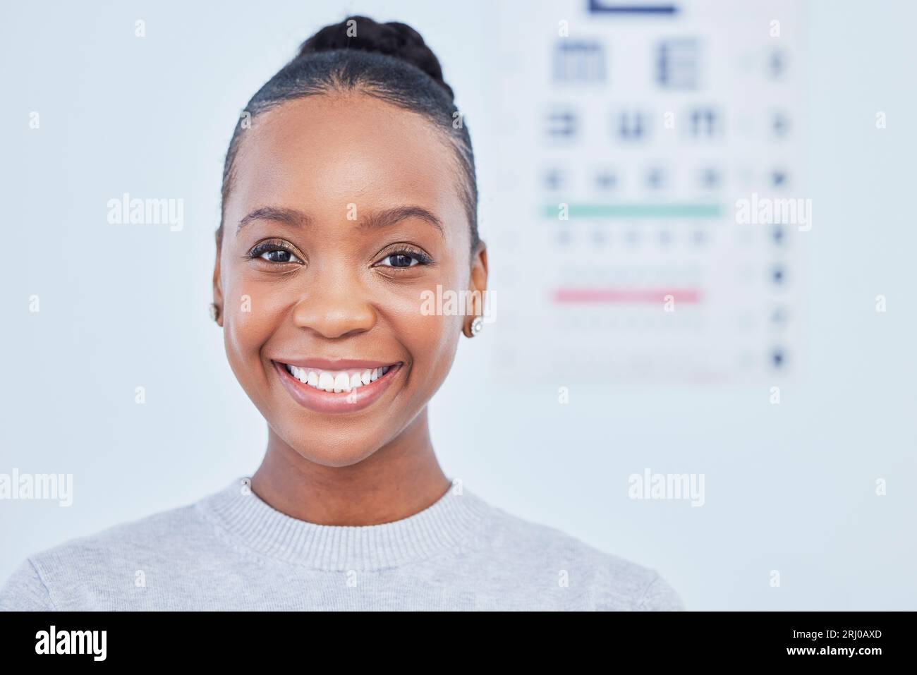 Face, black woman smile and ophthalmology patient in hospital for vision, healthcare or wellness. Portrait, optometrist and happy person in clinic Stock Photo