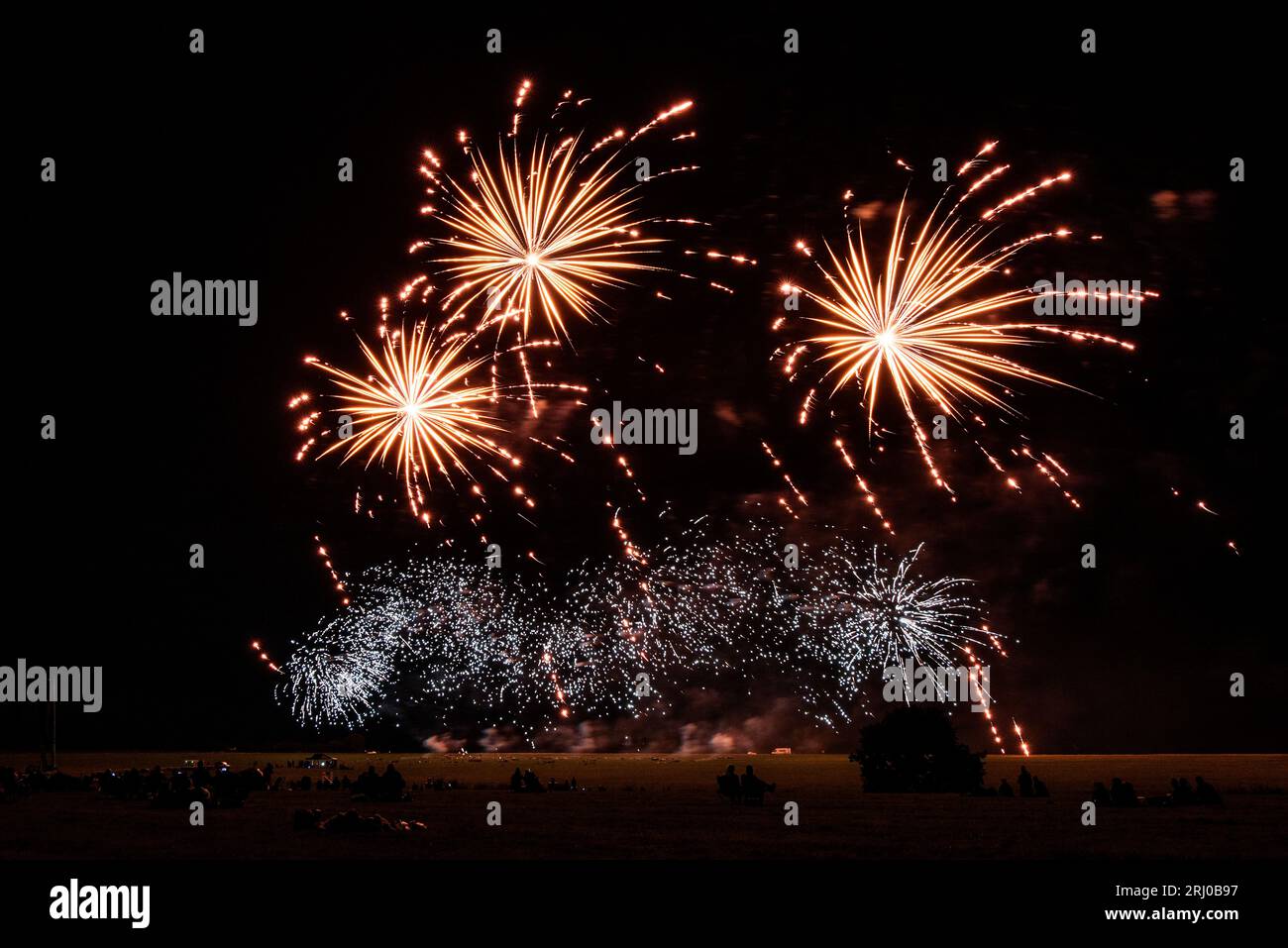 Belvoir Castle, UK. 19th Aug 2023. People watch the firework display by Gala Fireworks, as three companies compete against each other for the Firework Champions title, at Belvoir Castle, Leicestershire. Neil Squires/Alamy Live News Stock Photo