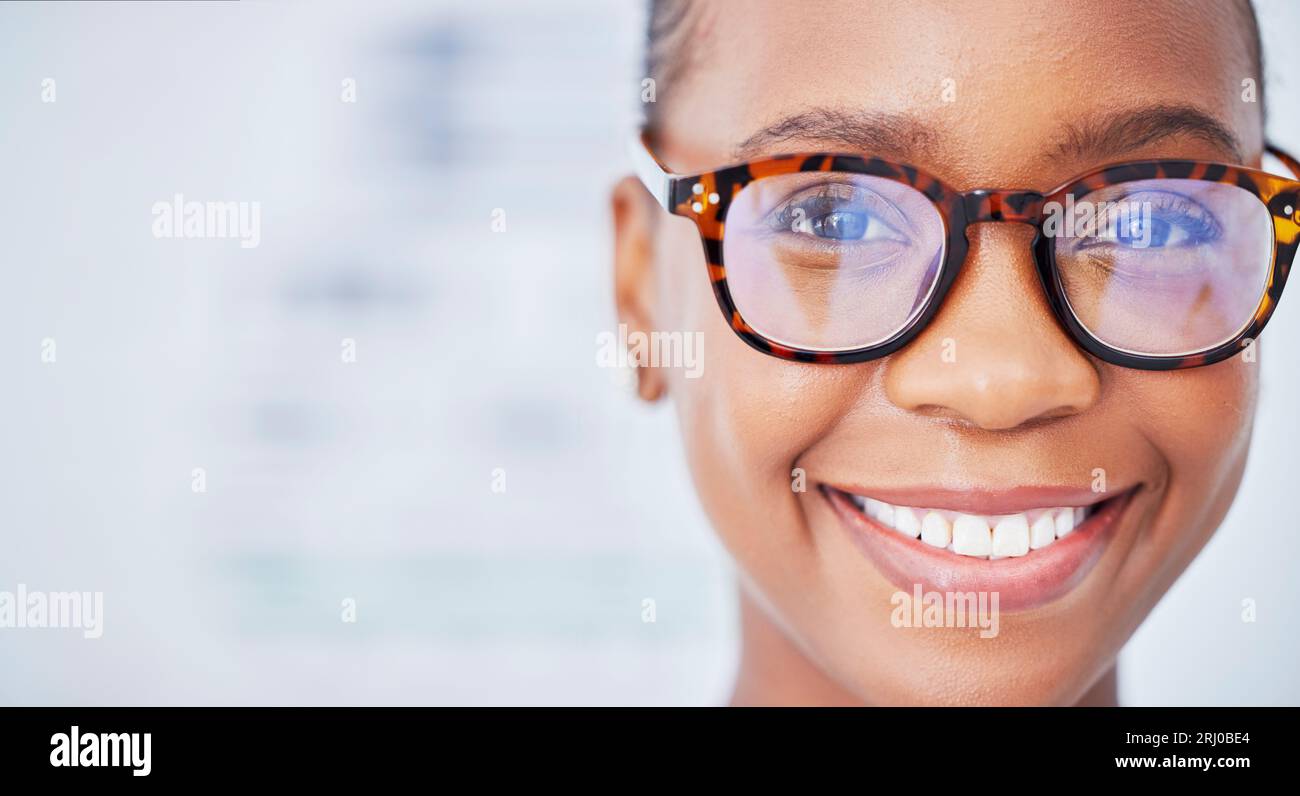 Face, black woman and glasses in ophthalmology, smile and vision in healthcare for wellness in hospital. Portrait, frame and African person in eyewear Stock Photo