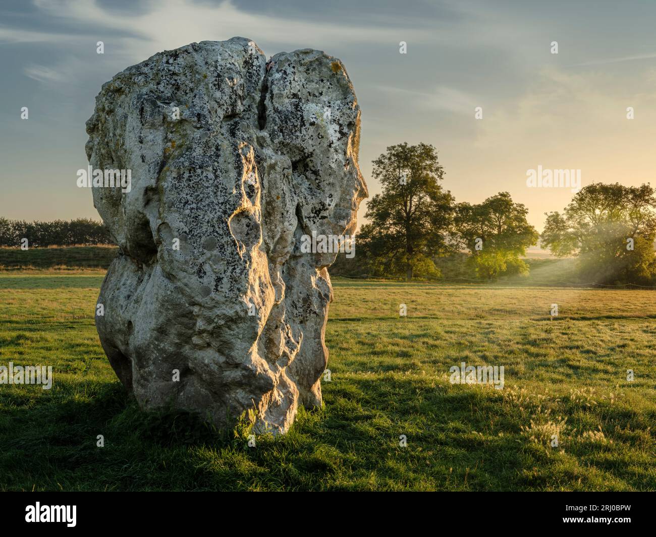 One of the large Neolithic Sarsen Stones that ring the Wiltshire village of Avebury. Stock Photo