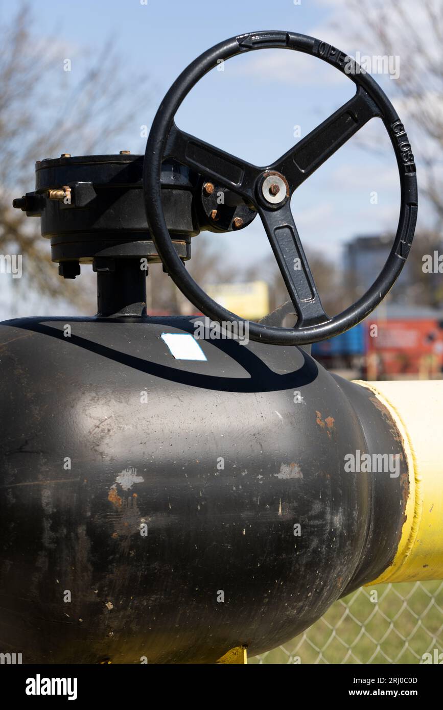 Yellow gas pipe with valve. Transportation, delivery of gas to