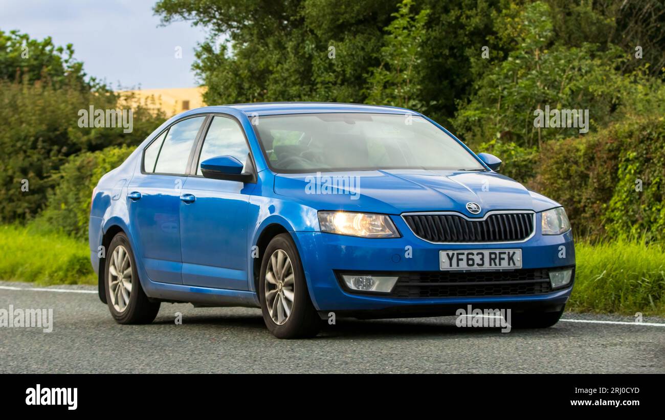 Woburn, Beds, UK - Aug 19th 2023:  Blue 2013 diesel Skoda Octavia car travelling on an English country road. Stock Photo