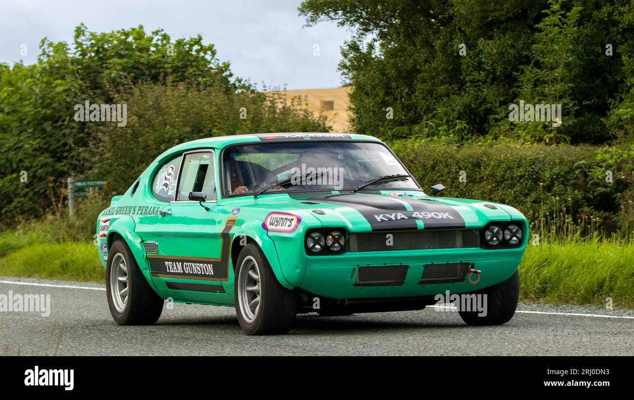 Woburn, Beds, UK - Aug 19th 2023: Basil Green's Perana Capri, a 1972 modified Ford Capri with a 4948 cc engine car travelling on an English country ro Stock Photo