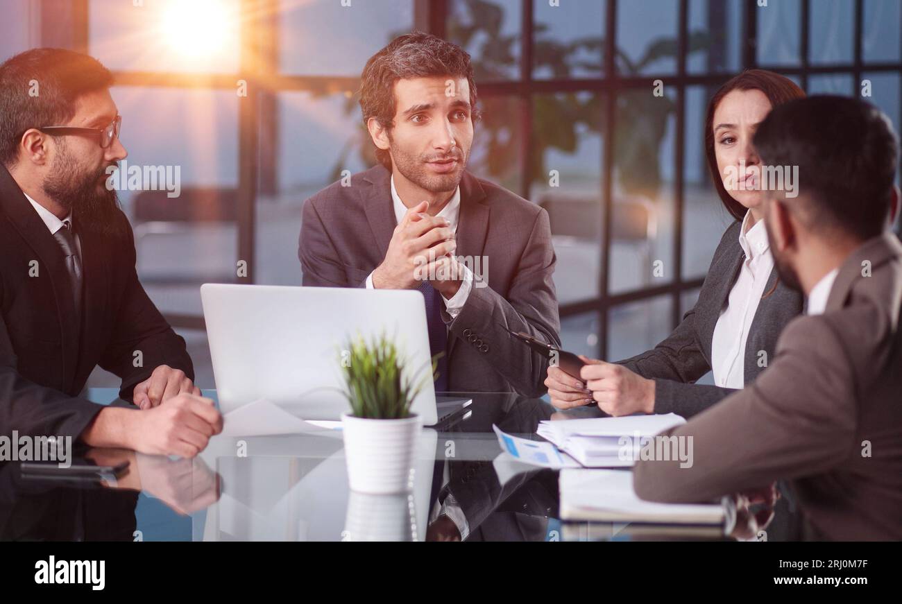 Teamwork - discussion in the office. young and successful Stock Photo ...