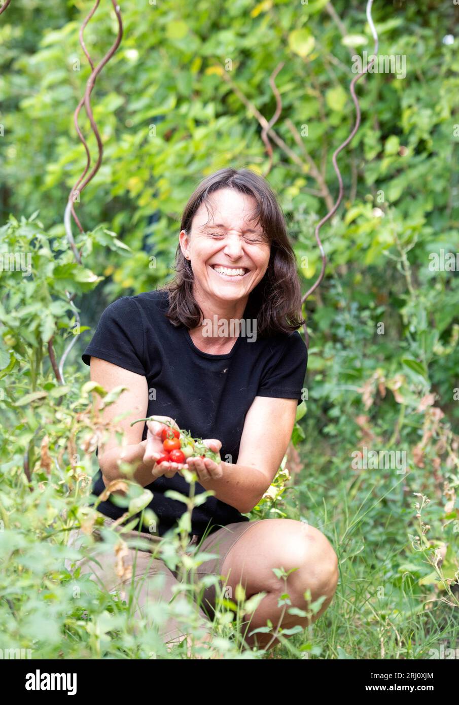 Woman gardening in the garden hi-res stock photography and images - Alamy