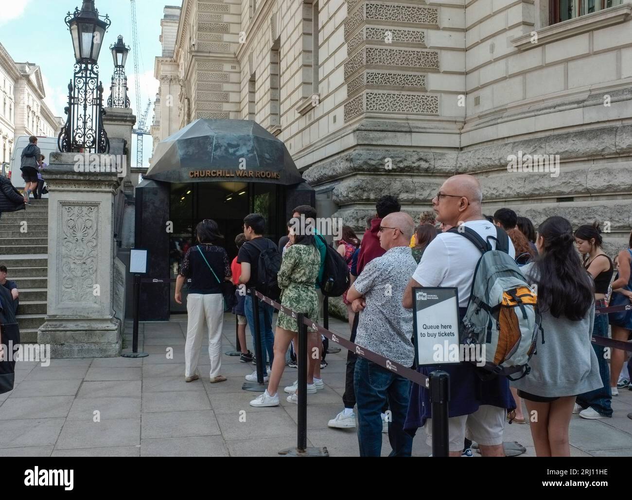 Tourists queue outside the Winston Churchill War rooms bunker in Whitehall , London, UK Stock Photo