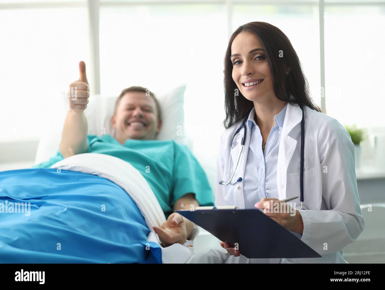 Man hospital bed shows gesture approval doctor Stock Photo Alamy