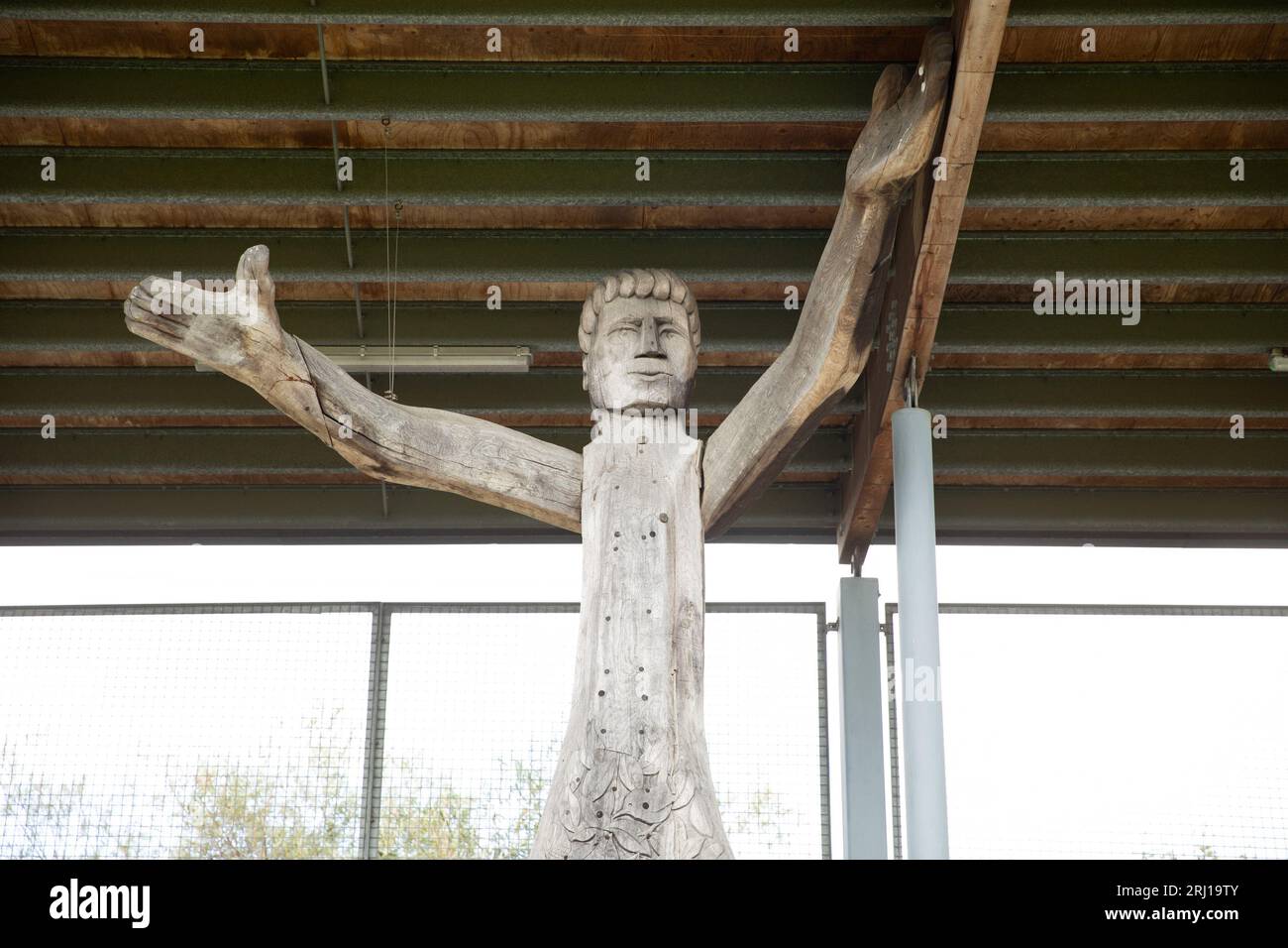 Wooden man holding up the roof at Princes Park Stadium, Dartford Stock