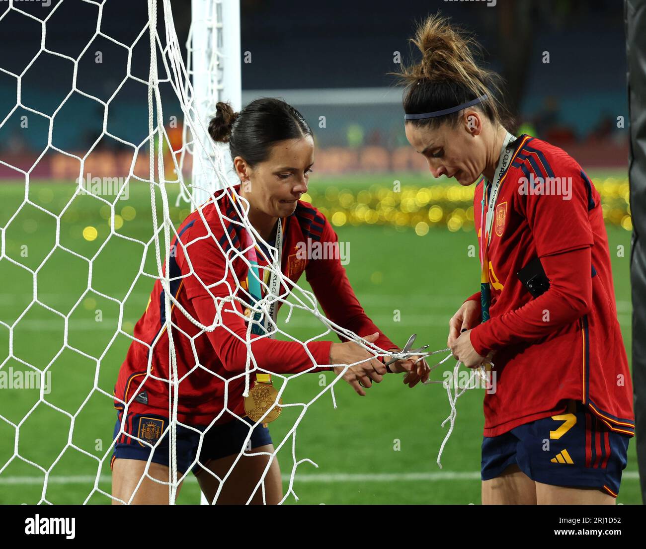 Spain's Claudia Zornoza (left) and Esther Gonzalez cut pieces of the net after the FIFA Women's World Cup final match at Stadium Australia, Sydney. Picture date: Sunday August 20, 2023. Stock Photo